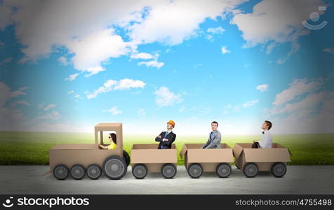 Interaction in business. Business people riding carton train. Teamwork concept