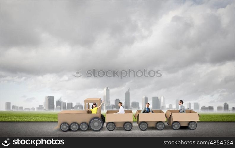 Interaction in business. Business people riding carton train. Teamwork concept