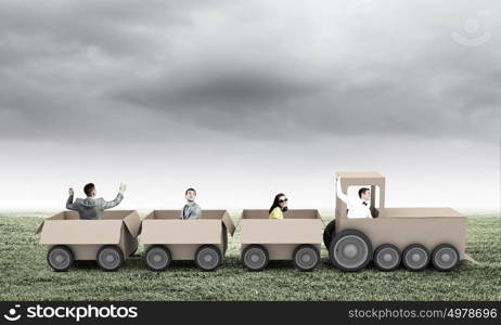 Interaction in business. Business people riding carton train. Teamwork concept