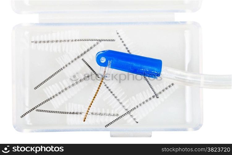 interdental tooth brush and tapered interdental brush refills in plastic box isolated on white background