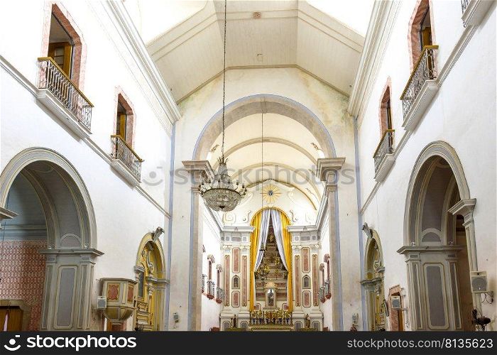 Interior and altar of a brazilian historic ancient church from the 18th century in colonial architecture in the city of Paraty, a UNESCO World Heritage Site, Rio de Janeiro State, Brazil. Interior and altar of a brazilian historic church from the 18th century in Paraty city