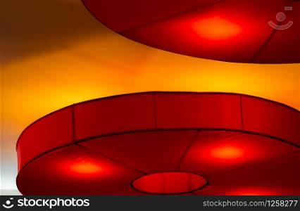 Interior ceiling red lights on dark background at night. Interior lighting concept. Red lights on ceiling wall. Interior architecture.