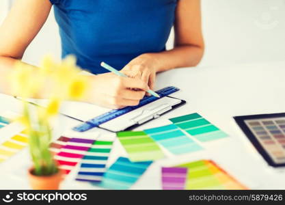 interior design and renovation concept - woman working with color samples for selection. woman working with color samples for selection