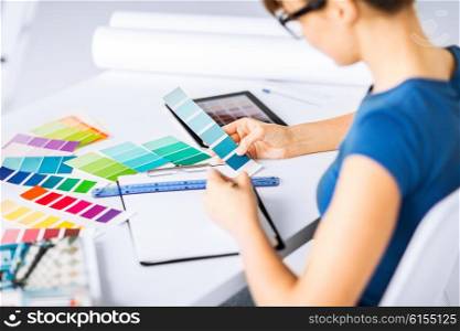 interior design and renovation concept - woman working with color samples for selection. woman working with color samples for selection