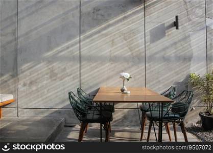Interior design   dining room with industrial background concrete wall and pot plant 