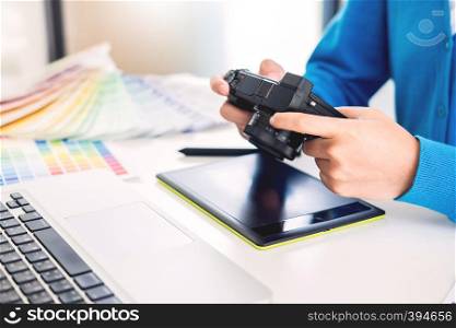 interior design or graphic designer renovation and technology concept - woman working with colour samples for selection. at workplace choosing colour swatches, closeup. Creative people