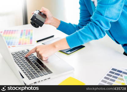 interior design or graphic designer renovation and technology concept - woman working with colour samples for selection. at workplace choosing colour swatches, closeup. Creative people