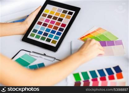 interior design, renovation and technology concept - woman working with color samples for selection