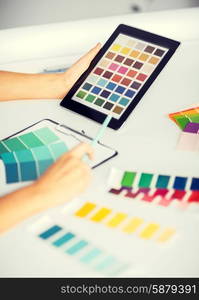 interior design, renovation and technology concept - woman working with color samples for selection