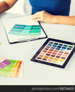 interior design, renovation and technology concept - woman working with color samples for selection