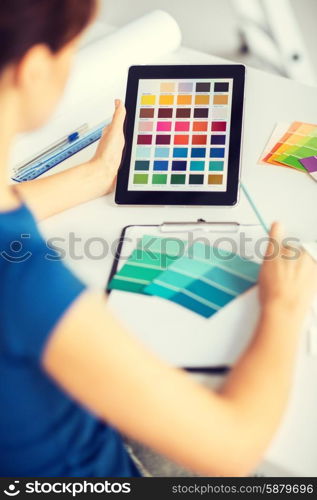 interior design, renovation and technology concept - woman working with color samples for selection