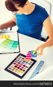 interior design, renovation and technology concept - woman working with color samples for selection