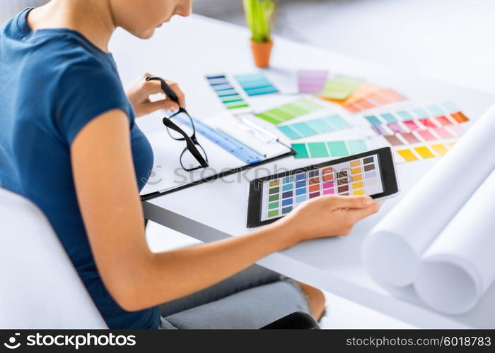 interior design, renovation and technology concept - woman working with color samples for selection