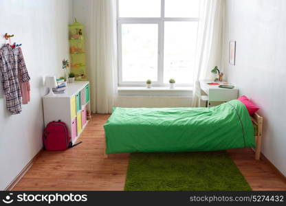 interior, home and furnishing concept - kids room with bed, table, rack and accessories. kids room interior with bed, table and accessories