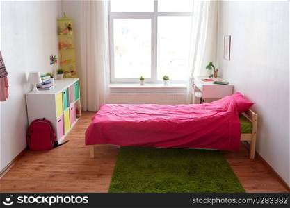 interior, home and furnishing concept - kids room with bed, table, rack and accessories. kids room interior with bed, table and accessories