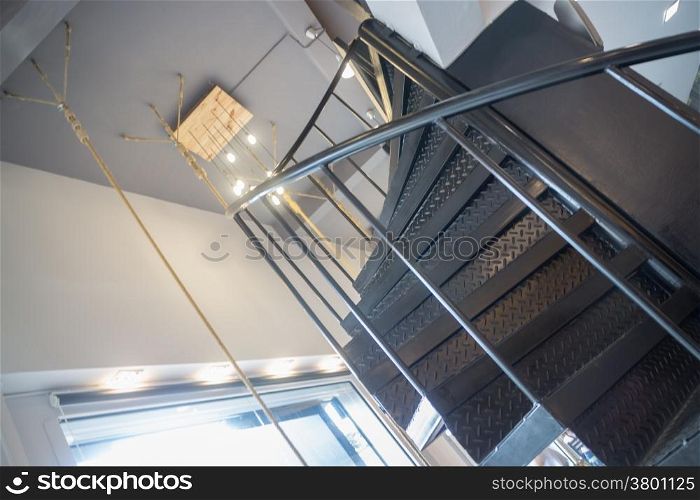 Interior metal dark spiral staircase, stock photo