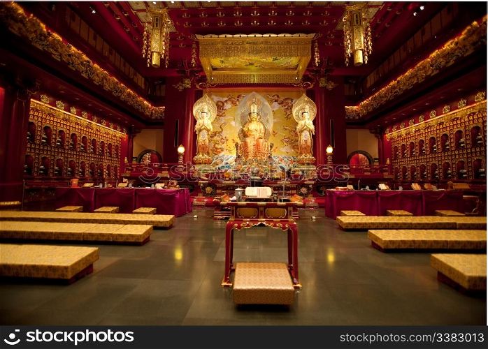 Interior of a Buddhist temple with many statues