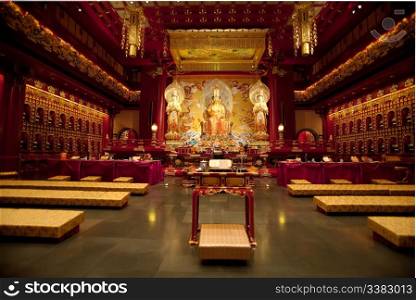 Interior of a Buddhist temple with many statues