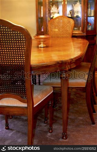 Interior of a cozy dining room with solid wood furniture