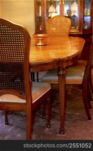 Interior of a cozy dining room with solid wood furniture