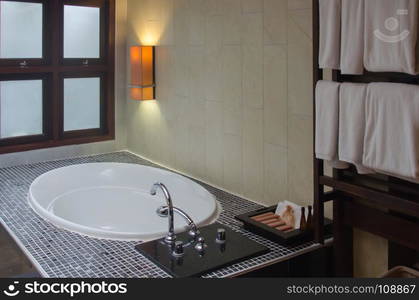 Interior of a modern bathroom with bathtub