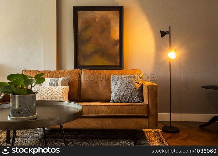 interior of a modern living room with brown sofa and blank painting, elegant retro design with brown sofa colorful. interior of a modern living room with brown sofa and blank painting, elegant retro design with brown sofa