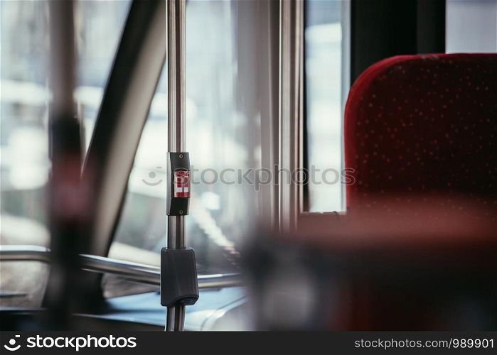 Interior of a public transport bus, stop button