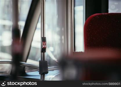 Interior of a public transport bus, stop button