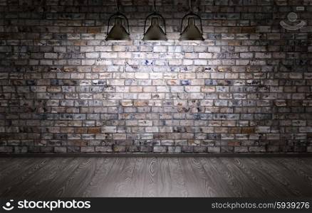 Interior of a room with brick wall and lamps