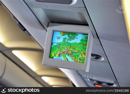 Interior of airplane with informational screens (Economy class)