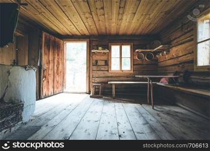 Interior of an old rustic abandoned alpine chalet in Austria