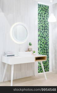 Interior of bathroom with washbasin faucet and white towel. Modern design of bathroom.