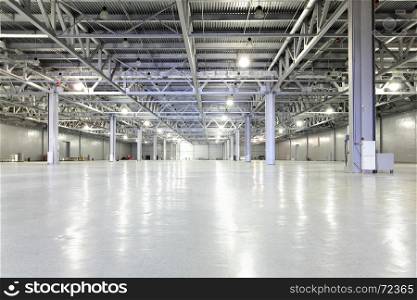 Interior of big empty storehouse