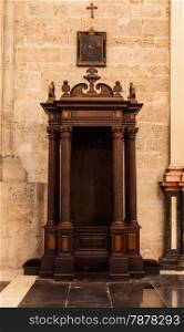 Interior of catholic church: confessional detail, 150 years old, made of wood