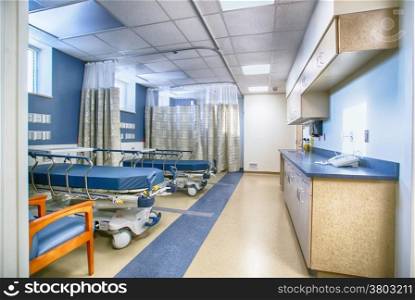 Interior of empty hospital patient recovery rooms