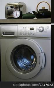 Interior of luxury laundry room with washing mashine