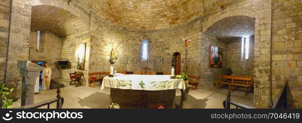 Interior of old stone hermitage in a village of the Pyrenees