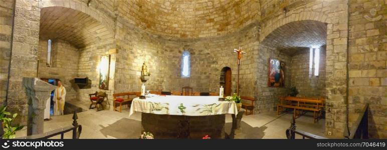 Interior of old stone hermitage in a village of the Pyrenees