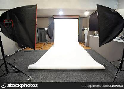 interior of professional photo studio with white background