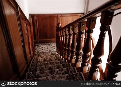 Interior of stairs, rustic Stairs made of wood inside the house. Stairs structure. selective focus.. Interior of stairs, rustic Stairs made of wood inside the house. Stairs structure. selective focus