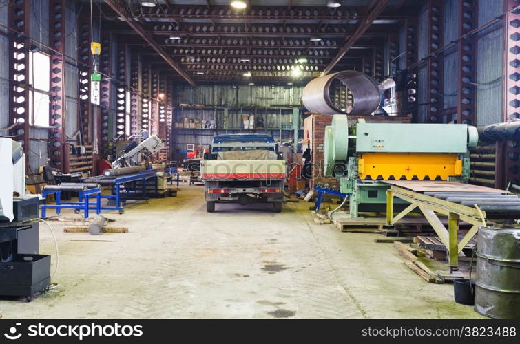 interior of storehouse and mechanical workshop with metal lathes and machines