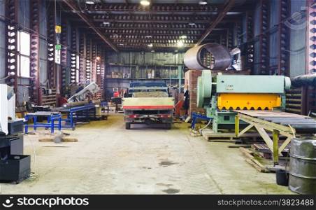 interior of storehouse and mechanical workshop with metal lathes and machines