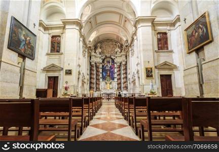 Interior of the 18th century baroque Parish Church of St Joseph, with a magnificent bas-relief sculpture on top of the altarpiece of the main chapel, in Lisbon, Portugal