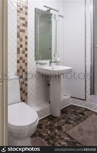 Interior of the combined toilet and bathroom in a small apartment