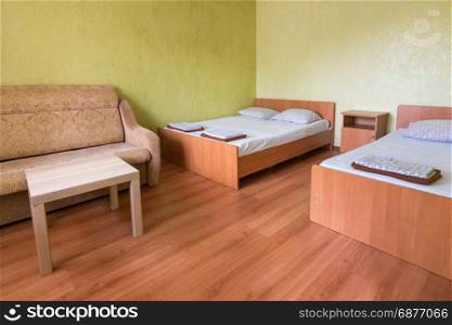 Interior of the room of a budget hotel with two beds