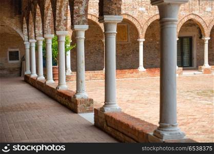 Interior on old brick house with columns in Venice, Italy. Interior on old brick house with columns