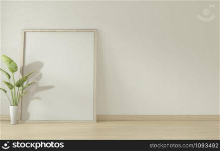 Interior poster mock up with wooden frame standing on wood floor and decoration plants.3D rendering
