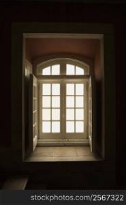 Interior recessed window lit with sunlight in Lisbon, Portugal.