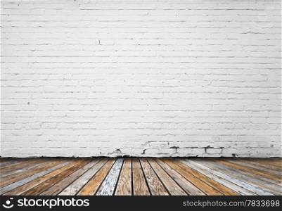 interior room with white brick wall and wooden floor