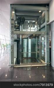 Interior shot of glass elevator at airport terminal